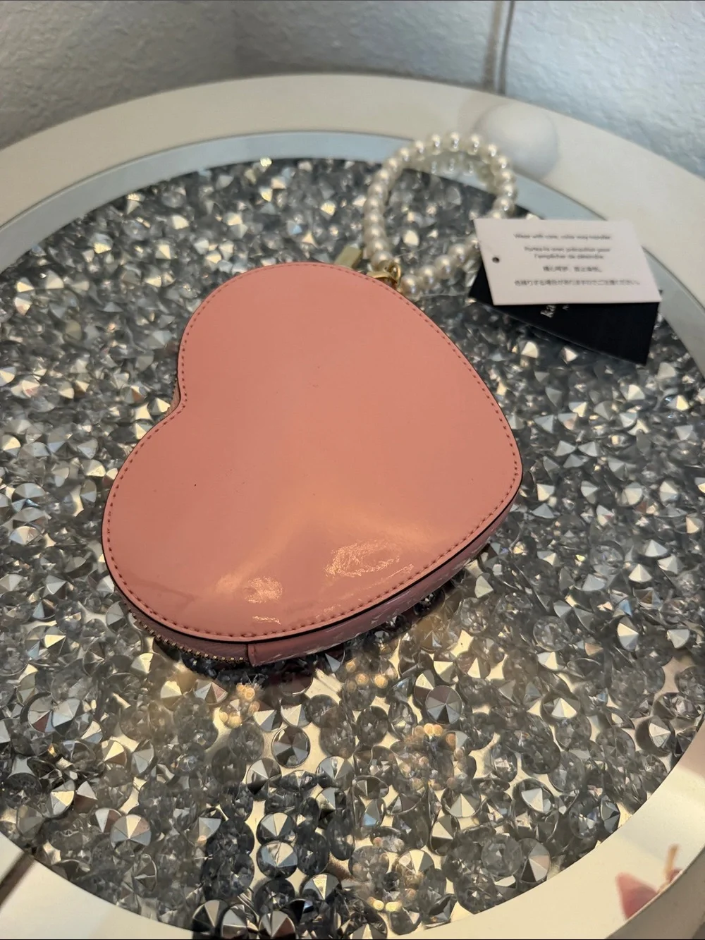 kate spade pink heart-shaped pearl wristlet clutch